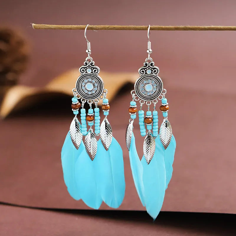 Handmade feather pattern bohemian earrings in multiple colours with leaf design detail
