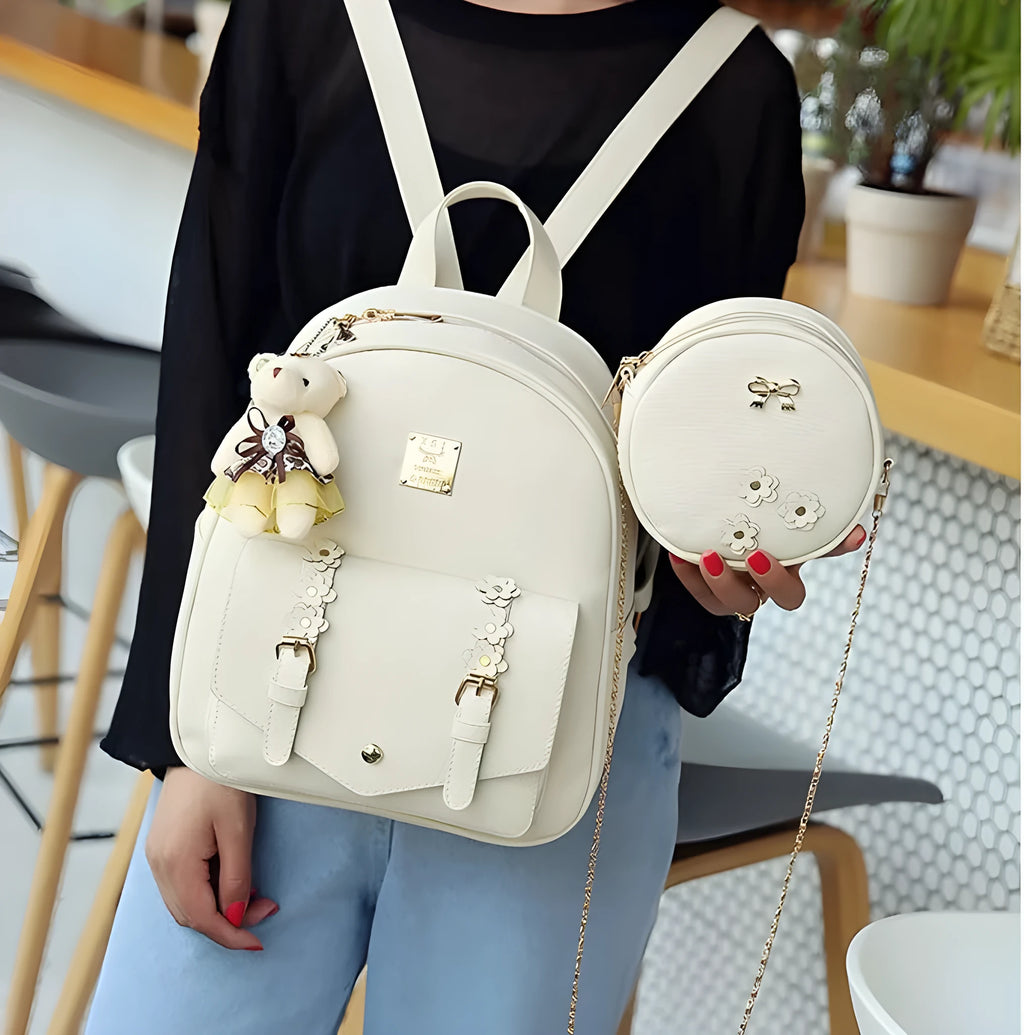 Women's three-piece leather bag set with floral embroidery including backpack, shoulder bag and card holder