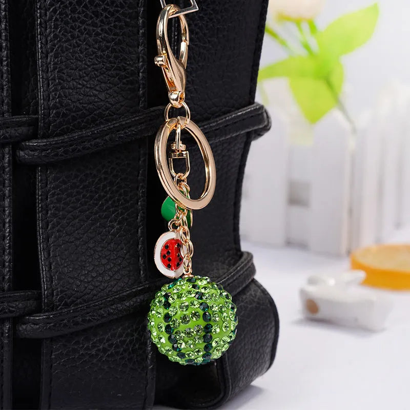 Green watermelon slice zinc alloy keychain measuring 12cm with keyring loop.