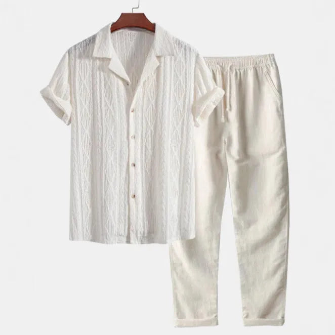 Lightweight linen-feel casual suit set with camouflage print trousers and a short-sleeved lapel shirt.