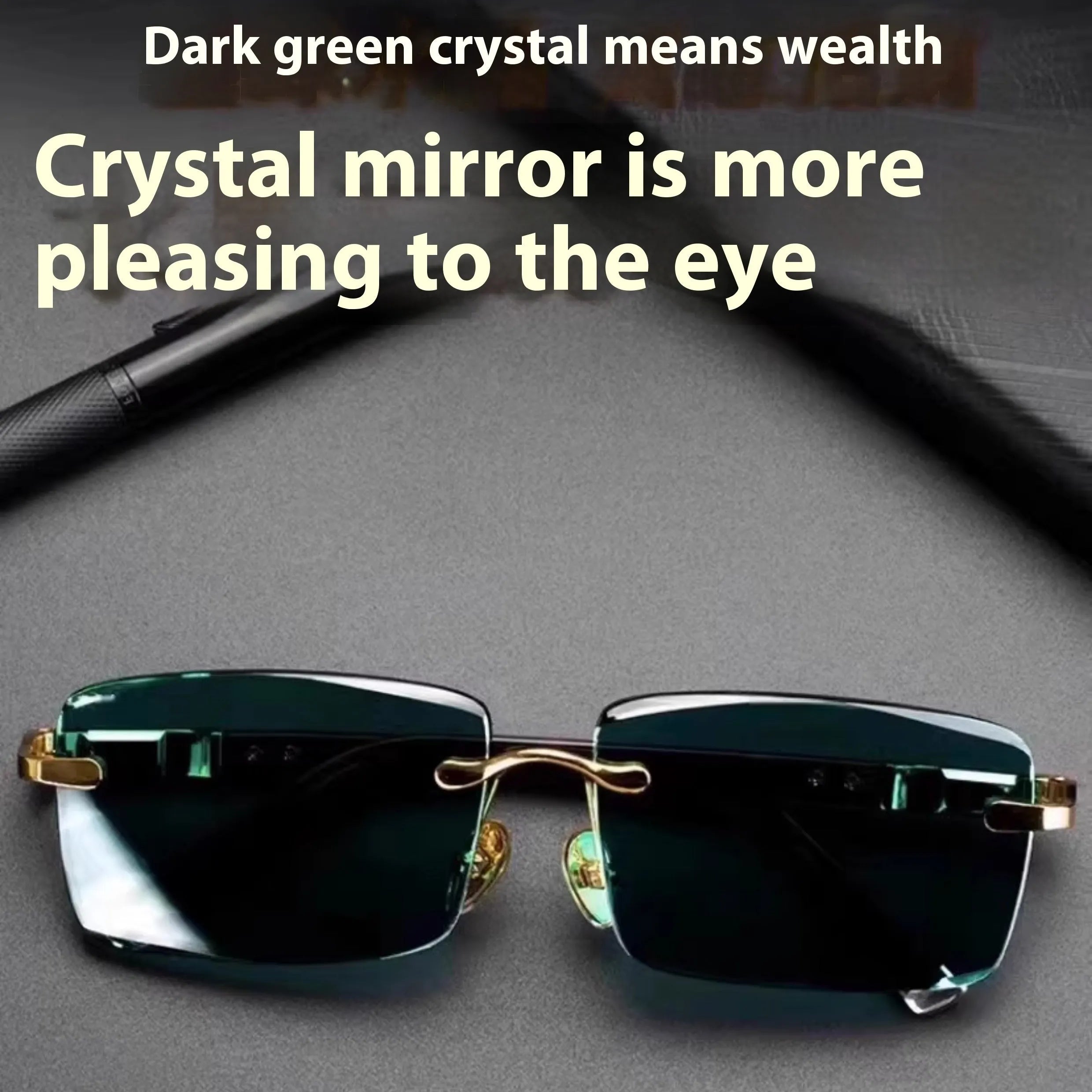 Frameless dark green crystal sunglasses with metal arms on a table next to their hard case.