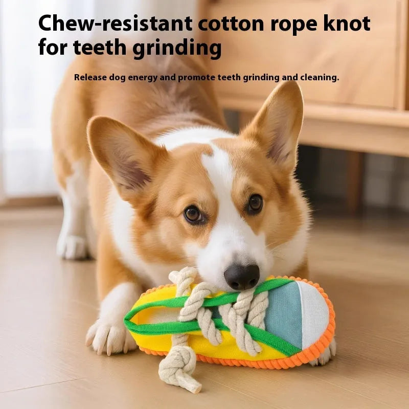 Yellow plastic dog slippers chew toy with a squeaker on a white background.