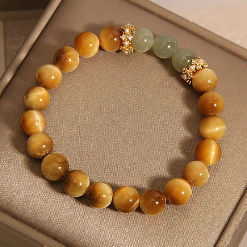 Natural yellow tiger's eye stone bracelet showing golden gourd, bamboo joint, and lace pattern variations