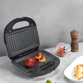 Black double-sided heating electric sandwich pan with brushed stainless steel lid and non-stick plates