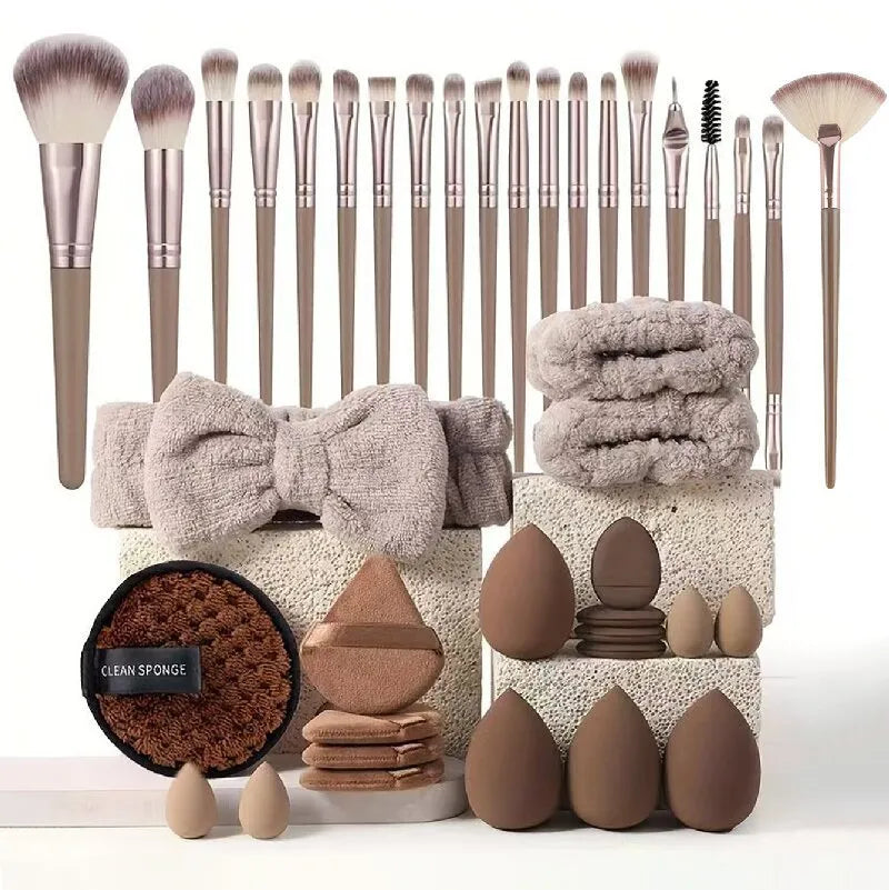 Beauty tool combination set with multiple pieces in brown, pink, and purple colours for face wash and makeup application
