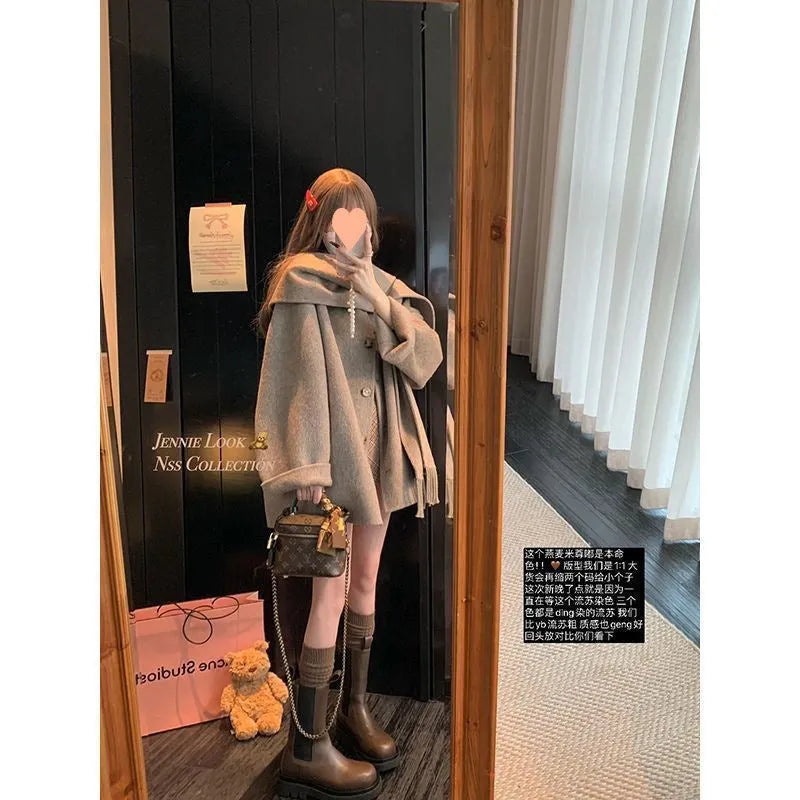 Gold Cloak loose-fitting tassel woolen coat in cream white on a female model