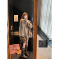 Gold Cloak loose-fitting tassel woolen coat in cream white on a female model