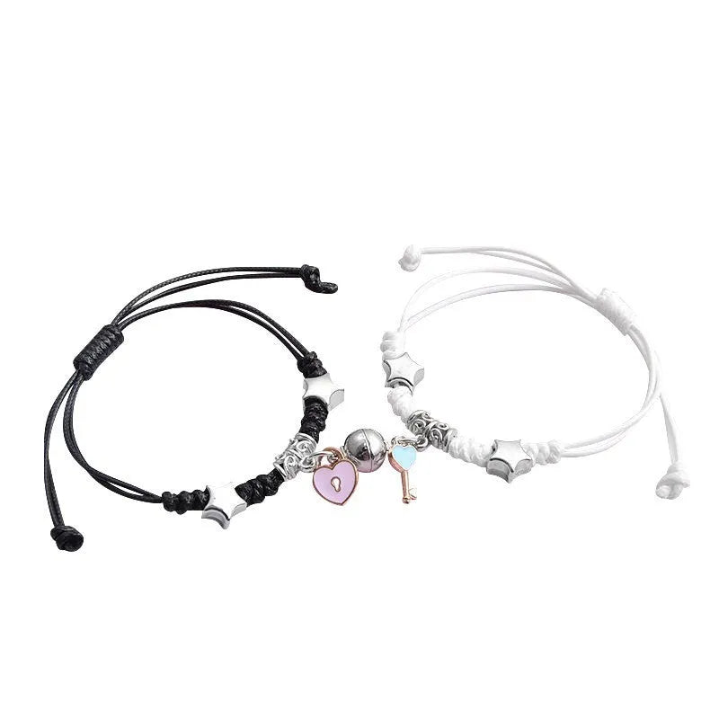 Magnet suction couple bracelets with alloy construction and various pendant designs including crowns and hearts