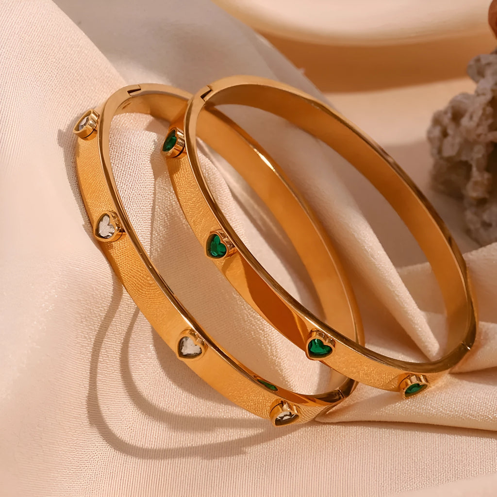 Gold electroplated stainless steel bracelet with micro-inlaid peach heart design and diamond accents