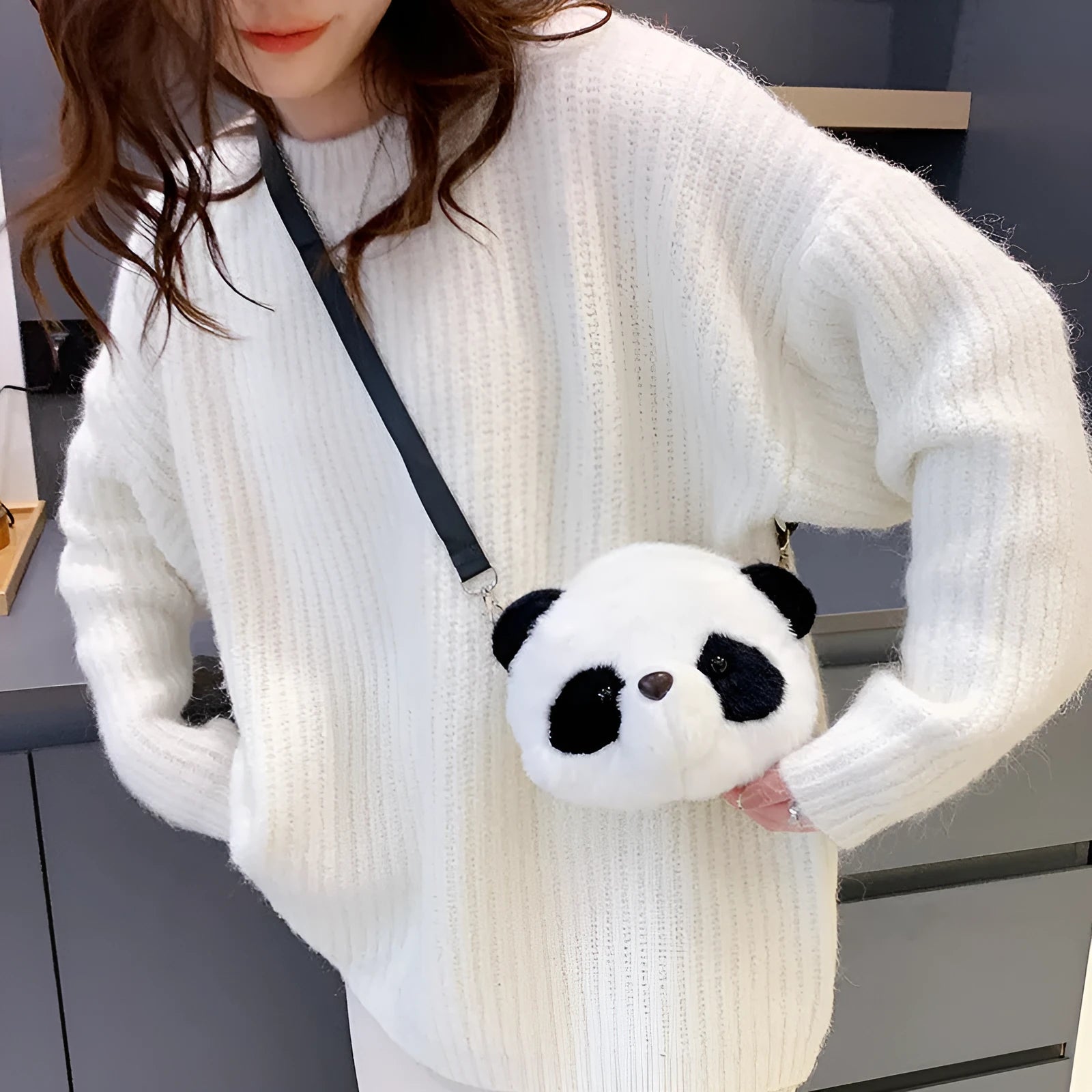 Soft plush cylindrical crossbody bag in Panda Head colour, showing dimensions and sandwich pocket.