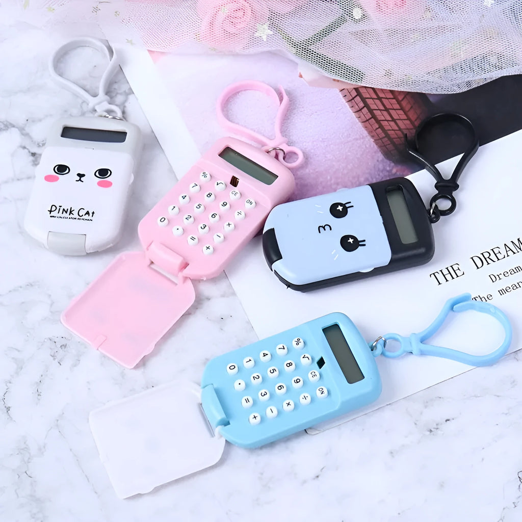 Cookie-shaped mini plastic calculator with key ring, 6.4cm x 3.6cm x 11.2cm, in pink, blue, grey, or black