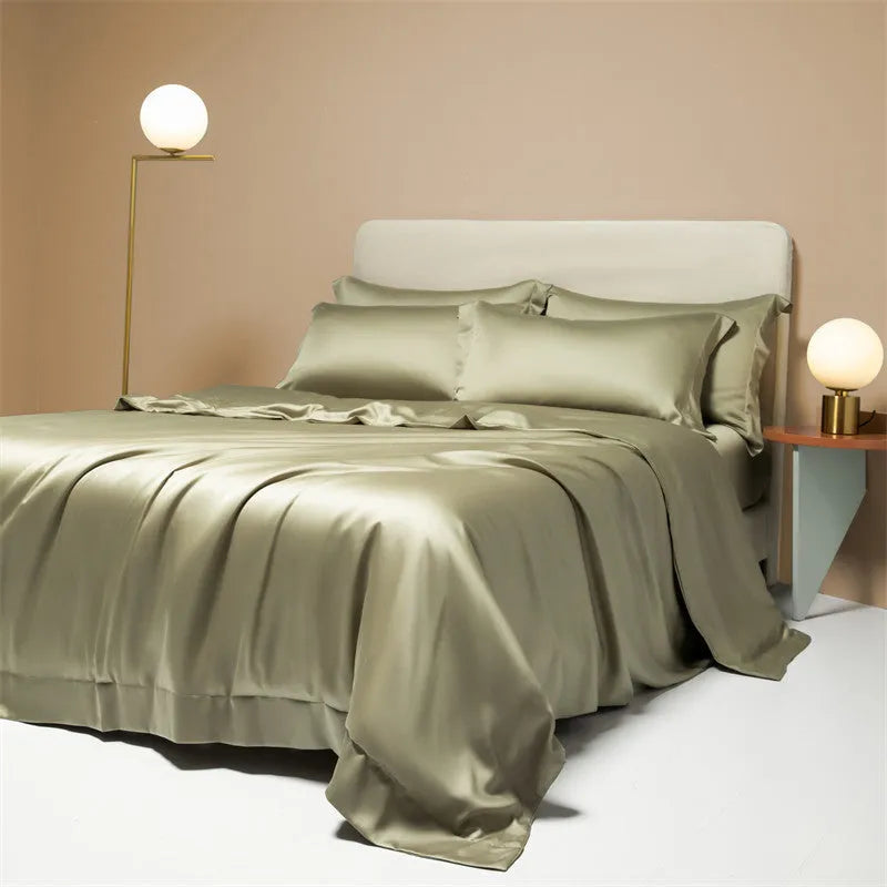 Luxury Lenzing Tencel bedding set in Aurora Blue on a bed, showing quilt cover, sheet, and two pillowcases.
