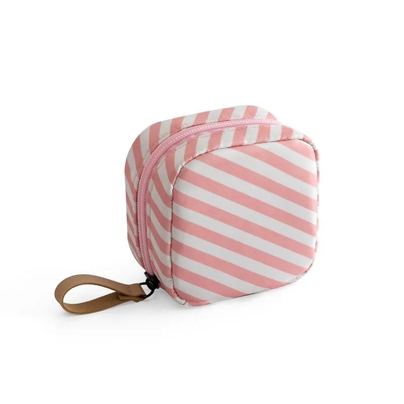 Cube-shaped cloth makeup storage bag in blue, pink, white, and white pink colour options