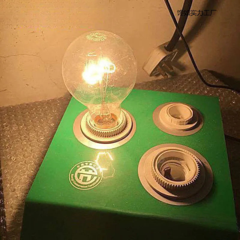 Old-fashioned incandescent tungsten bulb with E27 screw base, 220V, clear glass