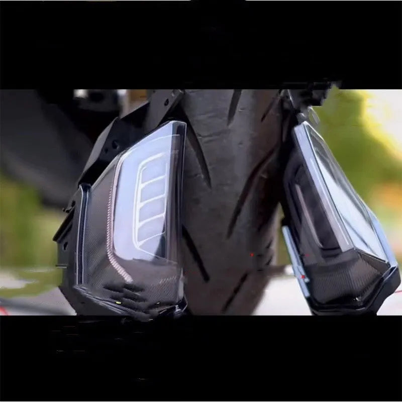 Blue and yellow LED turn signal light for Yamaha NMAX155 scooter.