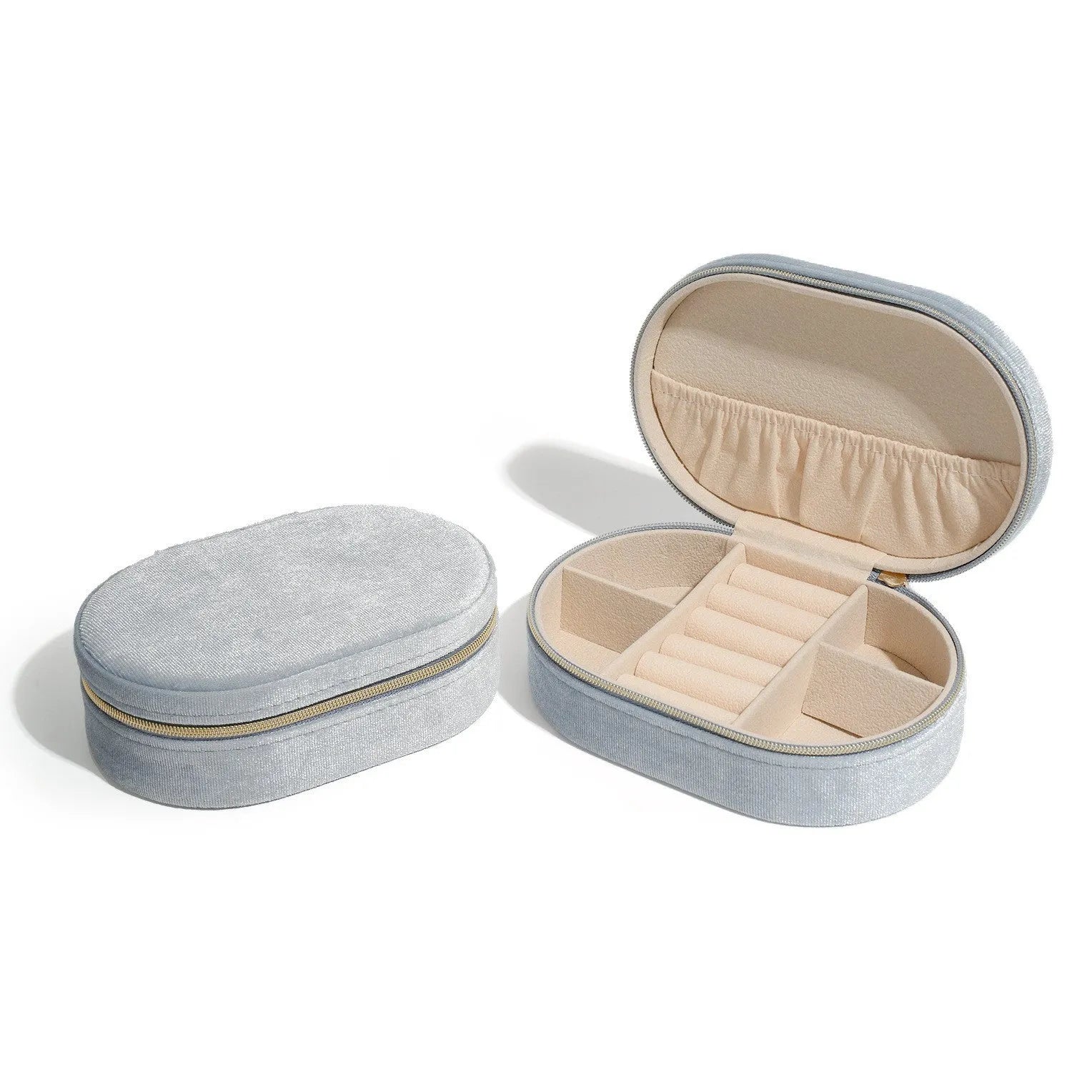 Oval velvet jewellery storage box in lake blue with internal hook for necklaces.