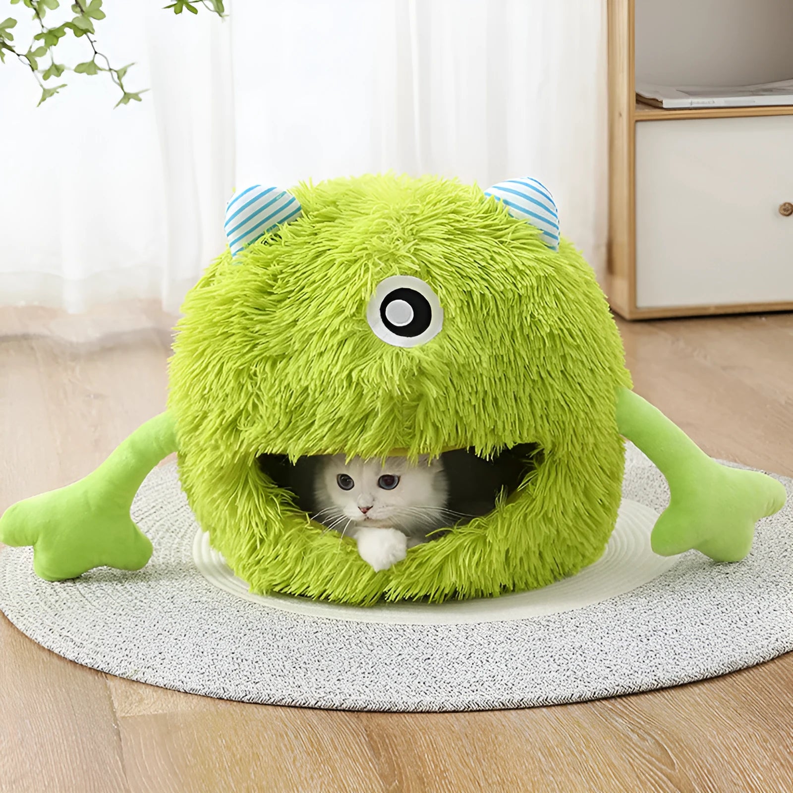 Round fluffy plush cat bed with non-slip base shown in three sizes: small, medium, and large.