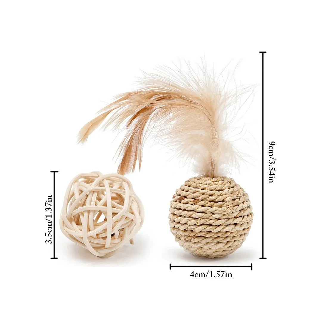 Two cat toy balls: one rattan ball and one faux feather ball with bell on a plain background.