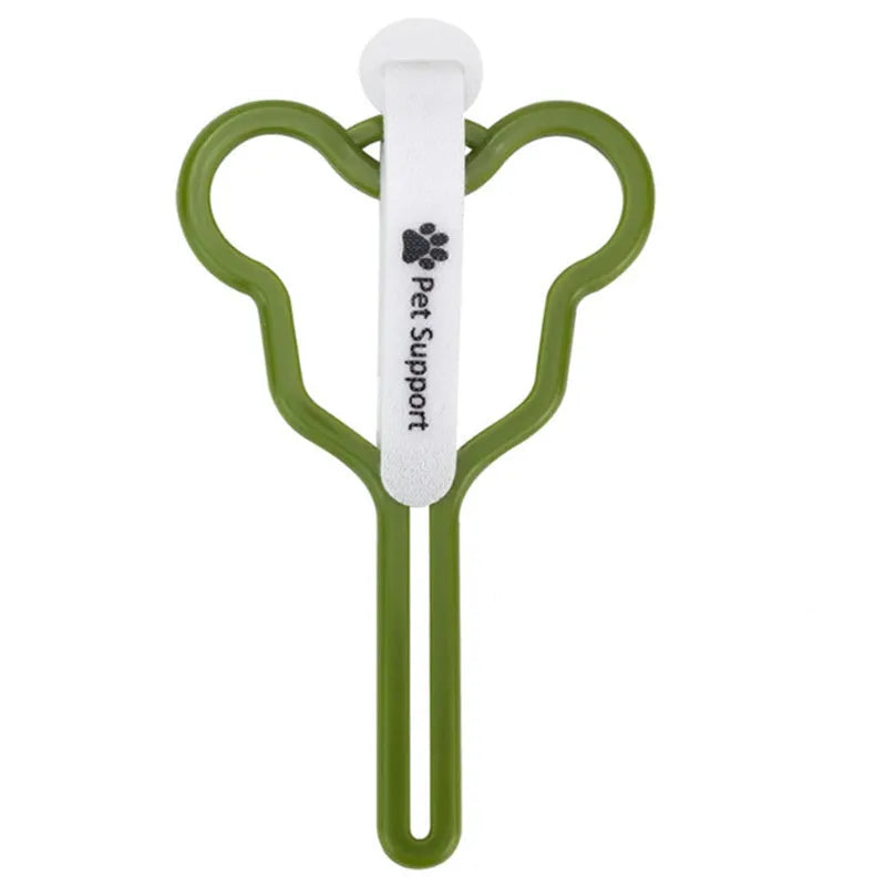 A dog poo bag holder with a hands-free clip and black Velcro strap attached to a leash.