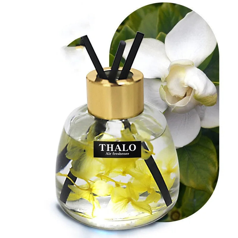 Glass bottle car perfume ornament with loose incense in decorative colours.