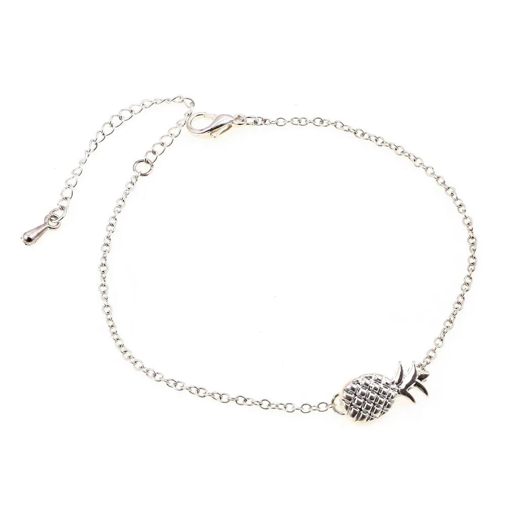 Women's alloy pineapple charm bracelet in gold or silver finish from XINGX series.