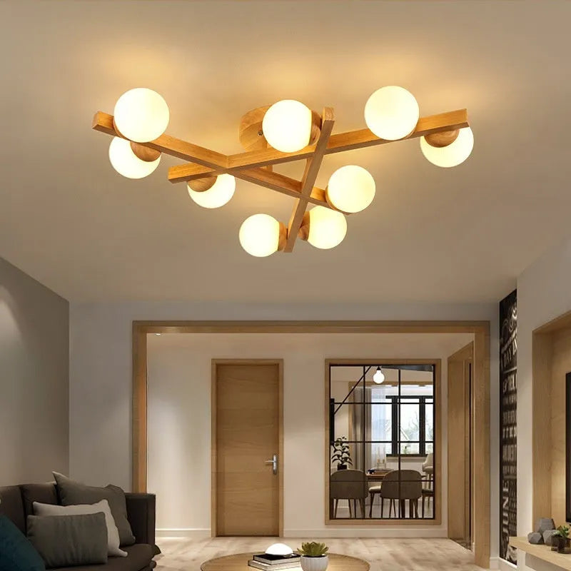 Nordic wooden-style ceiling light with three adjustable heads in a modern living room setting.