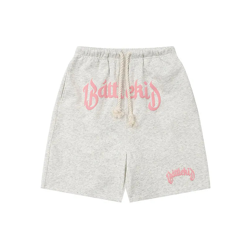 Loose grey cotton-blend street shorts with elasticated waist on a mannequin.