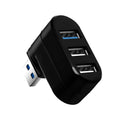 Black USB 3.0 four-port rotary hub on a desk next to a laptop, showing its compact size and rotating design.
