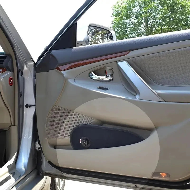 Black stretchy car side window sunshade fitted on glass with suction cups, shown twisted for storage.