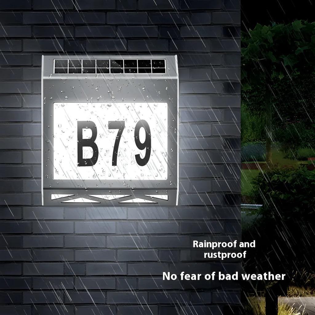 Solar powered waterproof doorplate light with LED address digits in black housing