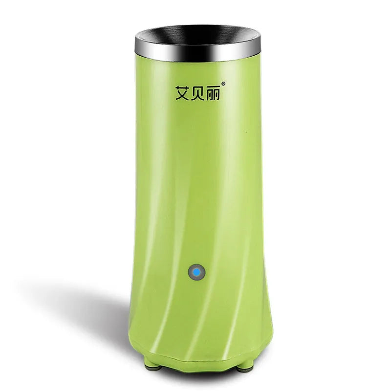 Beige white and green compact automatic mini breakfast machine on a kitchen counter.