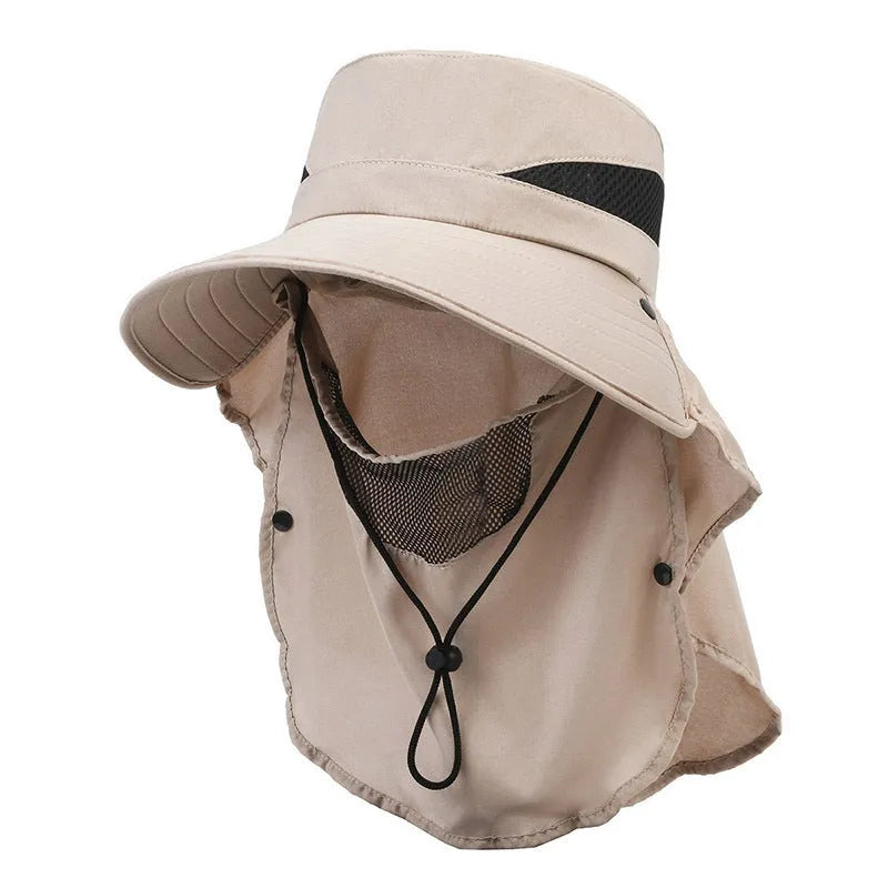 Men's grey fisherman hat with wide brim, shown from the side on a wooden post outdoors.