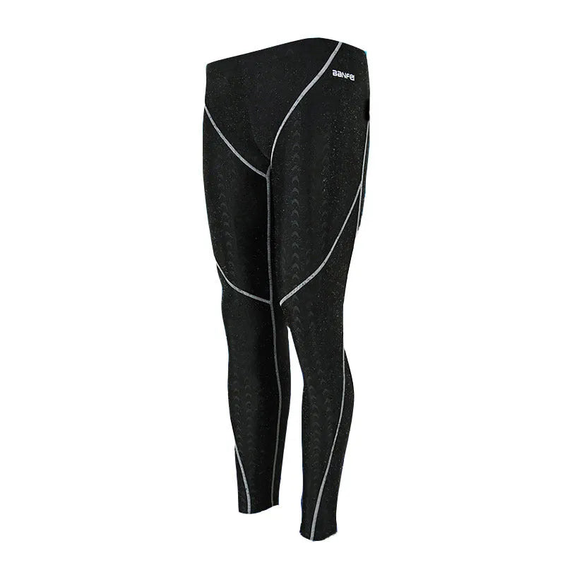 Men's black nylon cropped swimming trunks with grey line detail, brief style for sports