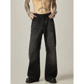 Black loose straight-leg jeans with a retro light wash and zip fly closure laid flat.