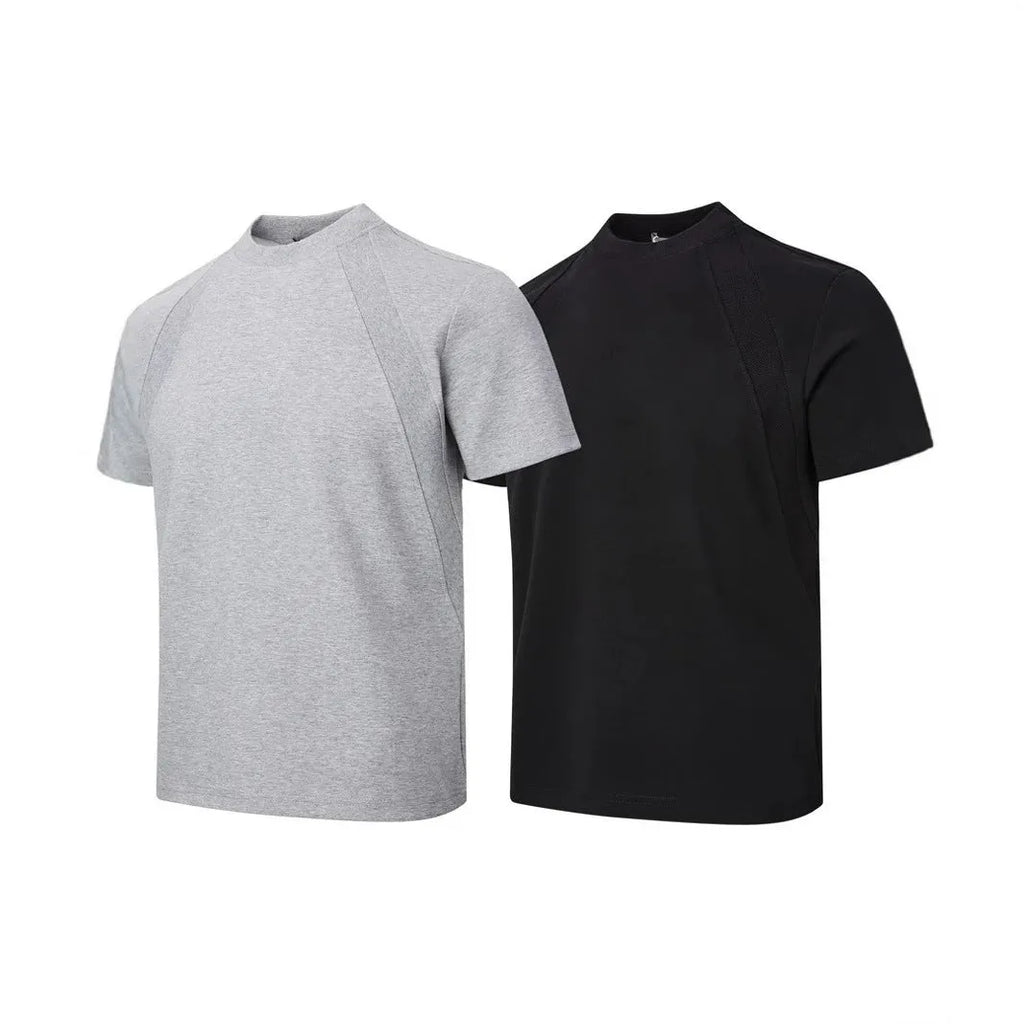 Men's loose fit short sleeve top in black with air layer stitching detail on a grey background.