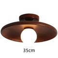 Solid wood modern minimalist ceiling lamp with glass shade in three sizes.