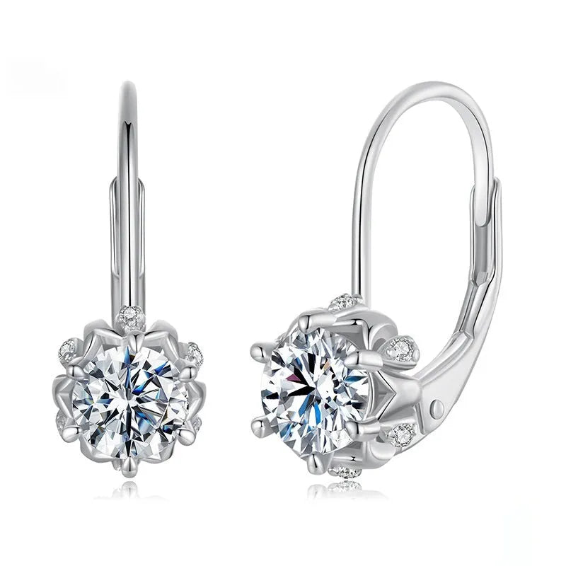 Sterling silver flower bud ear clips with white gold plating and a moissanite centre stone.