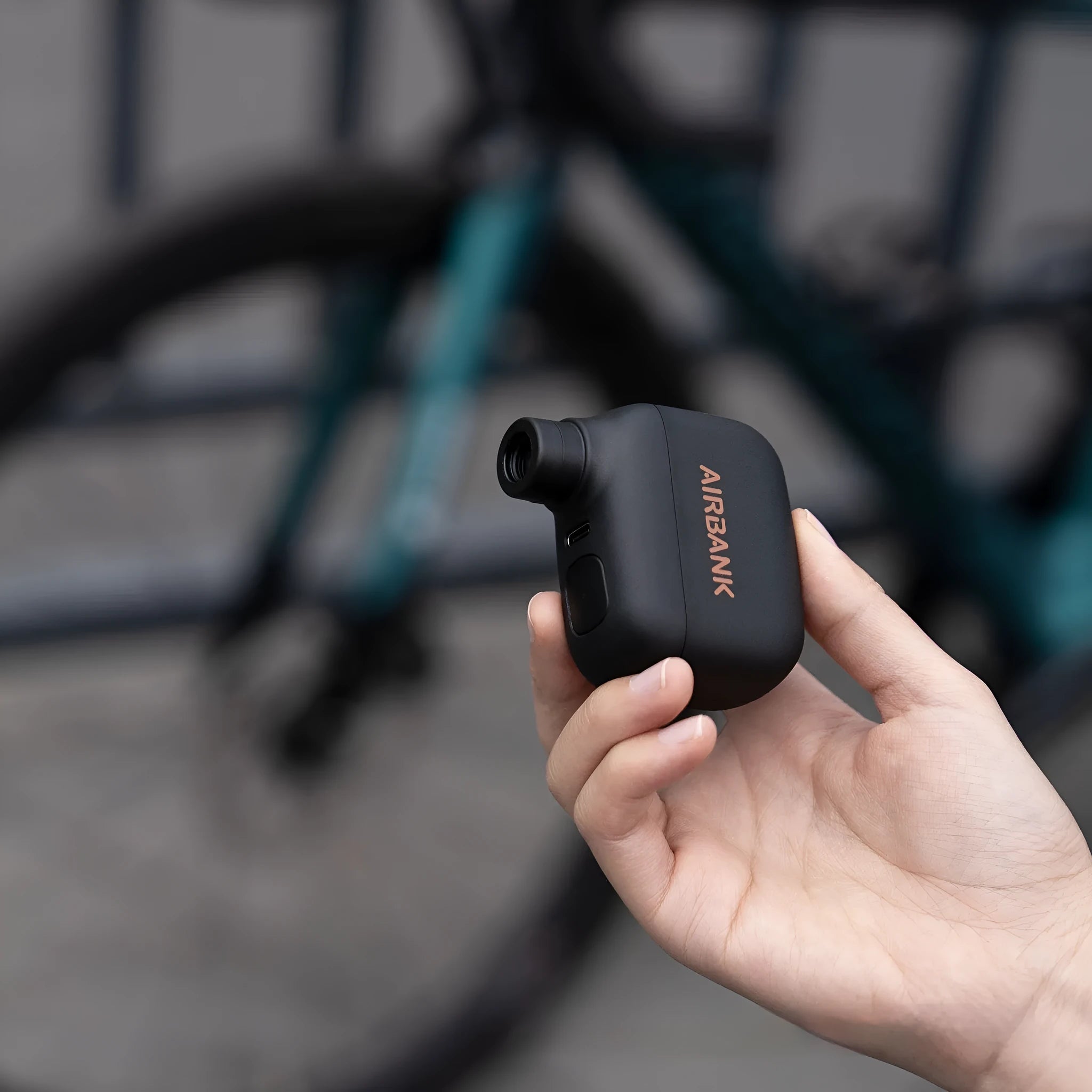 AS100 black electric bicycle pump with USB charging cable and waterproof storage bag