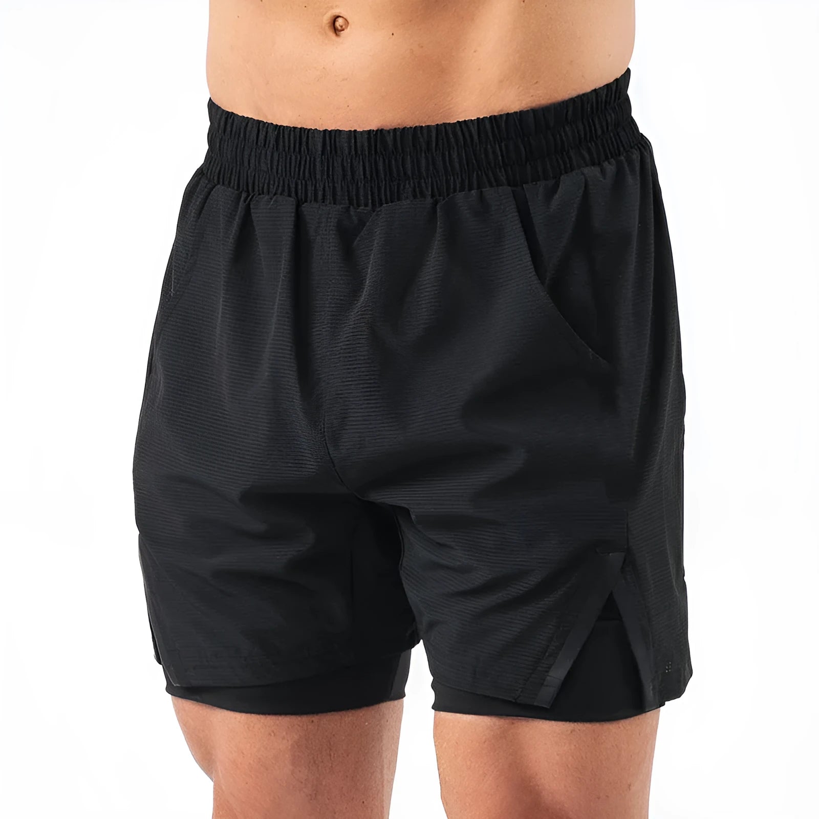 Man wearing quick-drying plaid sports shorts in army green, showing mid waist and shorts length.