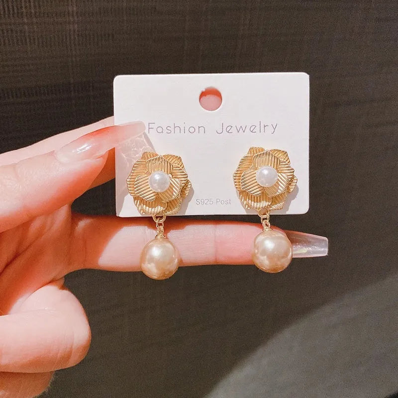 Gold electroplated floral stud earrings with opal stone and sterling silver posts in Hong Kong style design