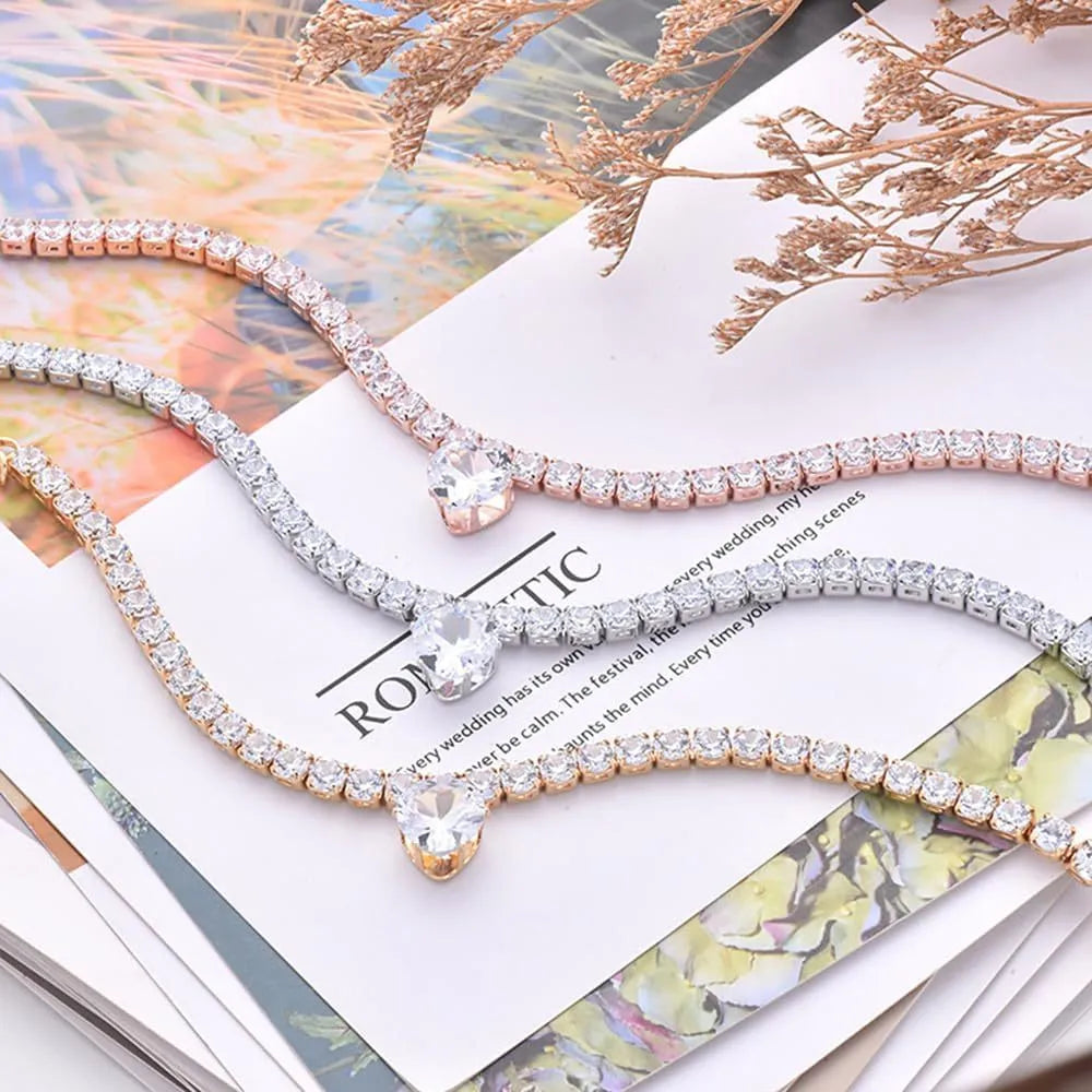 Heart-shaped rhinestone pet collar for dogs and cats in gold, with adjustment chain.