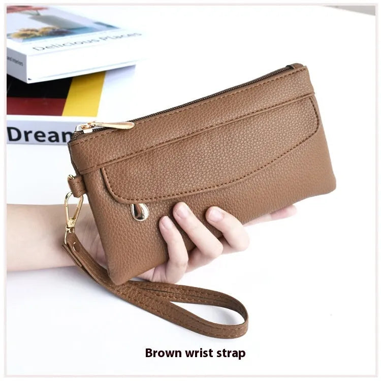 Soft PU leather crossbody bag in a square shape showing the internal sandwich zipper pocket.