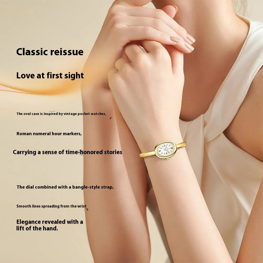 Women's oval retro quartz watch in gold with spiral pattern and slim 8mm profile