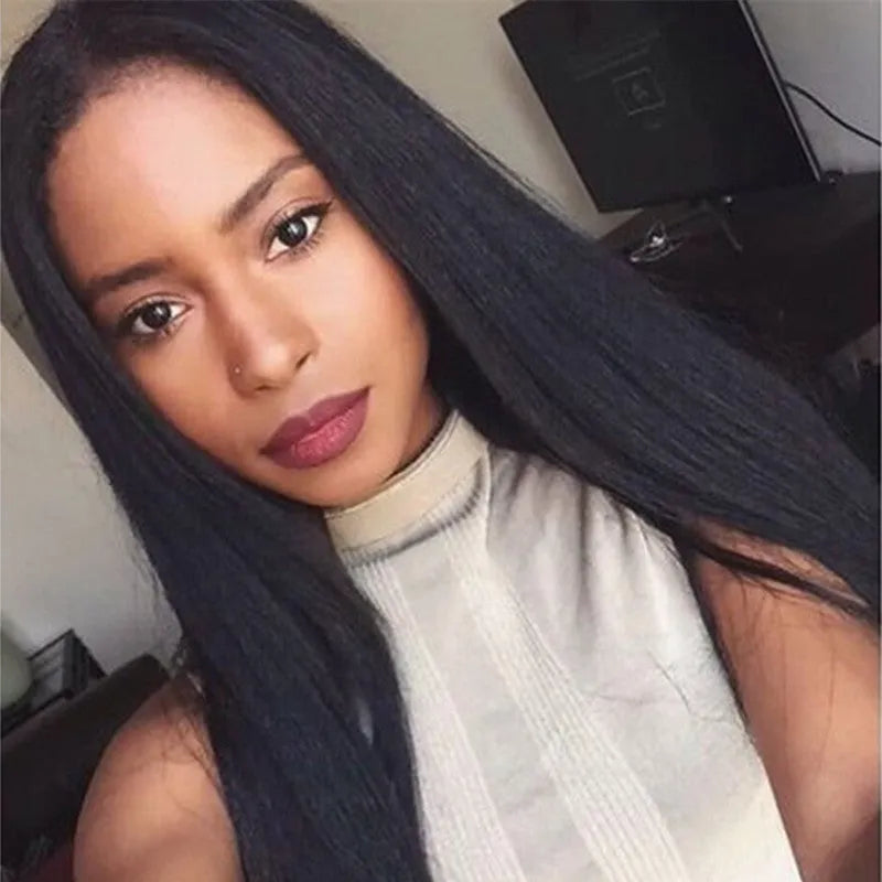 Women's long straight black synthetic wig with centre-part and bangs on a mannequin head