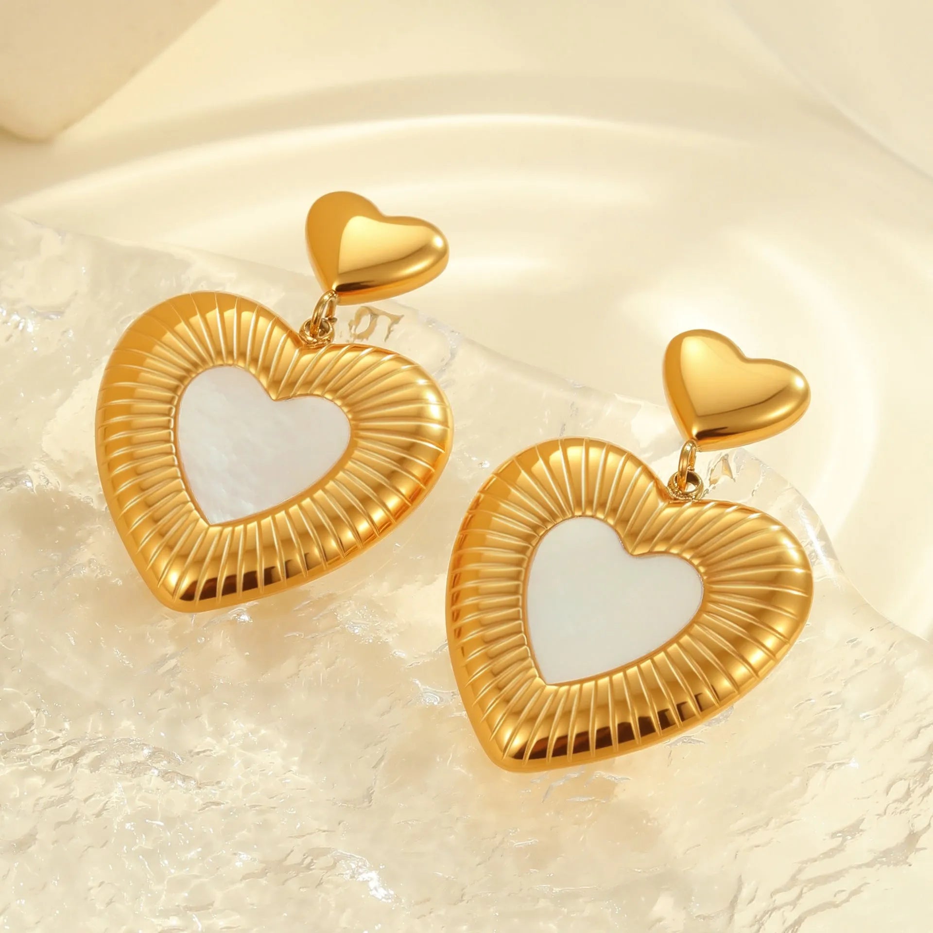 Gold electroplated heart-shaped stainless steel earrings with 18K finish for women