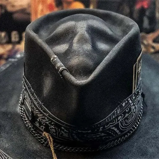 Handmade black wool felt skull hat with conical crown and textured denim-like finish.