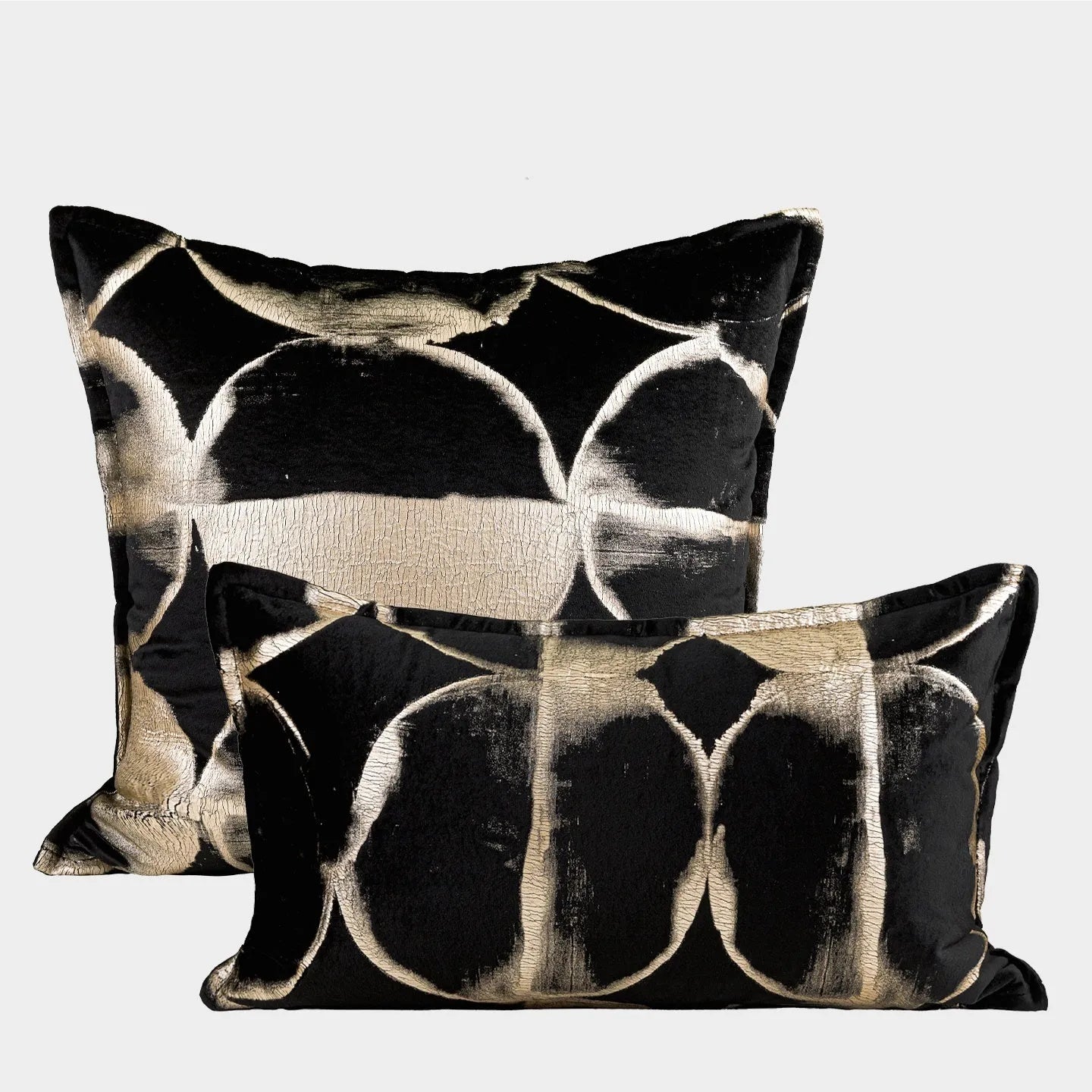 Black and gold abstract pattern flannel cushion cover on a sofa
