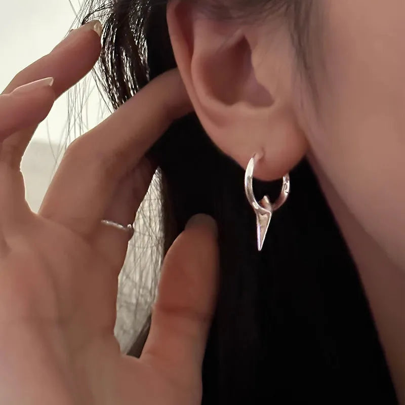 Platinum coloured geometric star shaped ear clips for women with a white gold plated finish