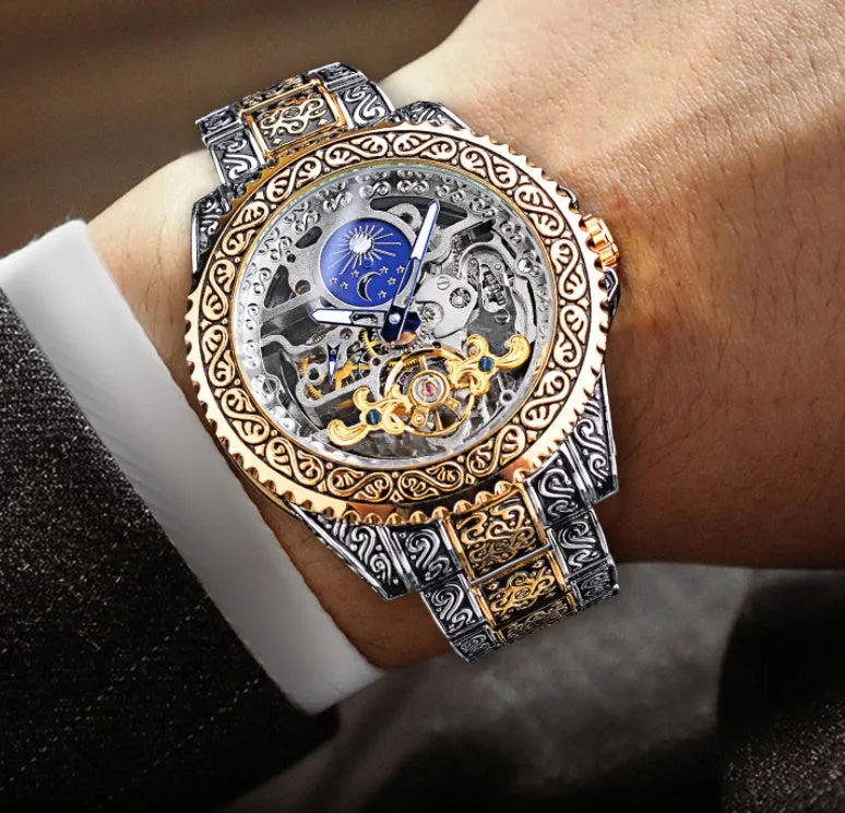 Men's automatic mechanical watch with hollow retro carved dial, moon phase display, stainless steel strap, 44mm gold finish