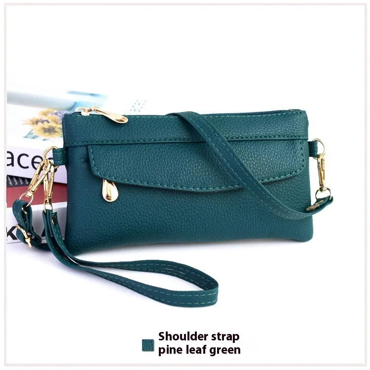 Soft PU leather crossbody bag in a square shape showing the internal sandwich zipper pocket.